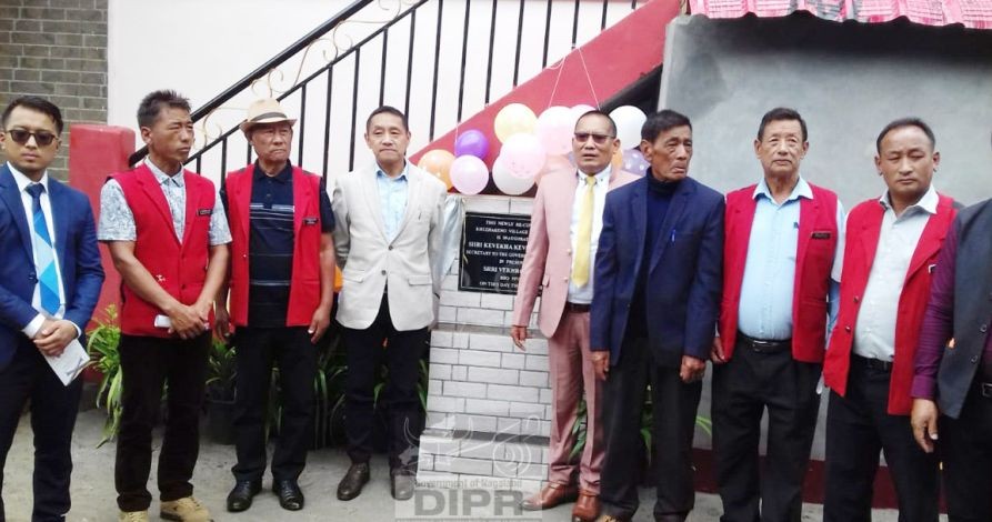 Secretary Zehol with village elders and government officials during the inauguration of Khezhakeno Village Council Hall on June 25. (DIPR Photo)